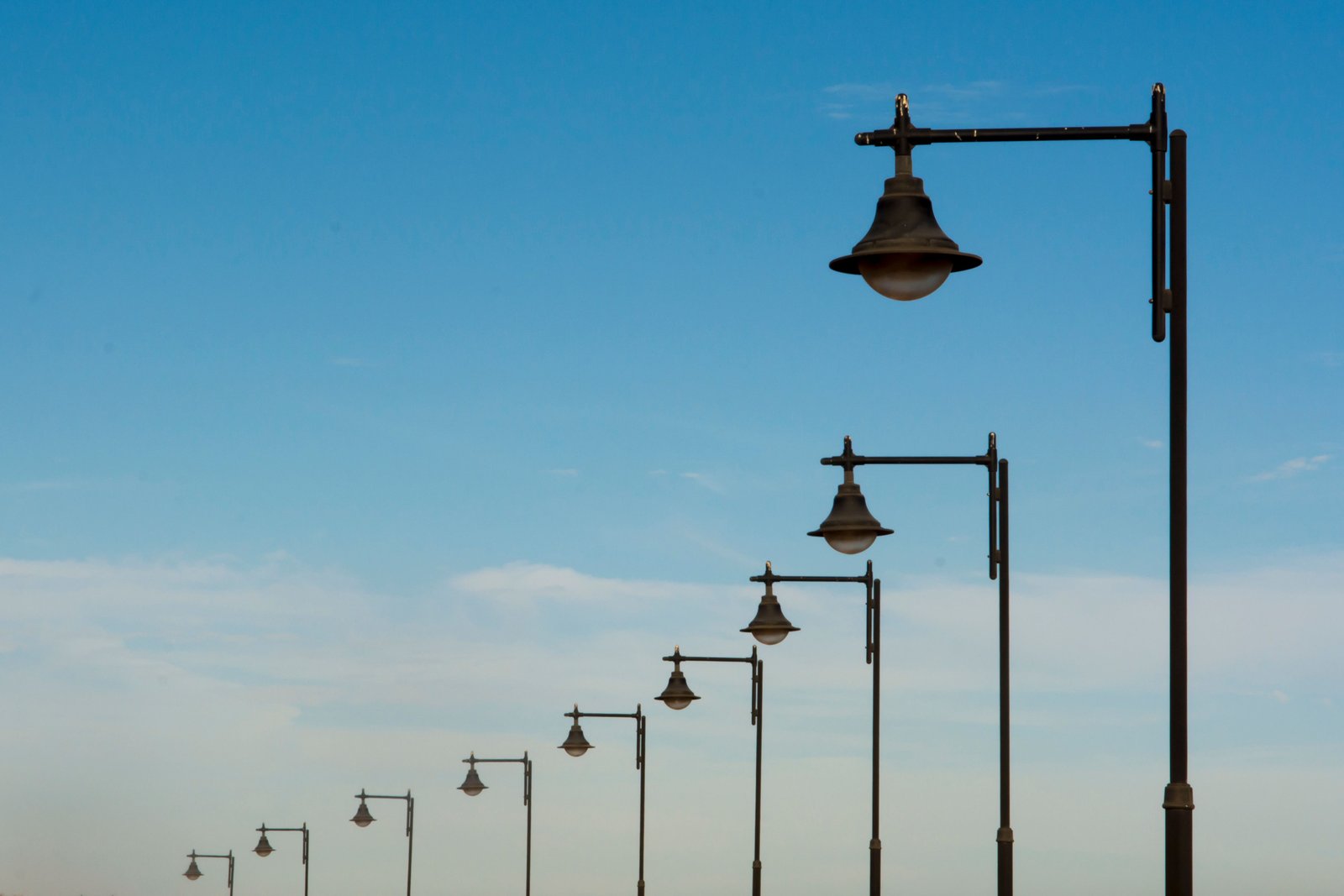 What specifications should you check before purchasing GI light poles in bulk?